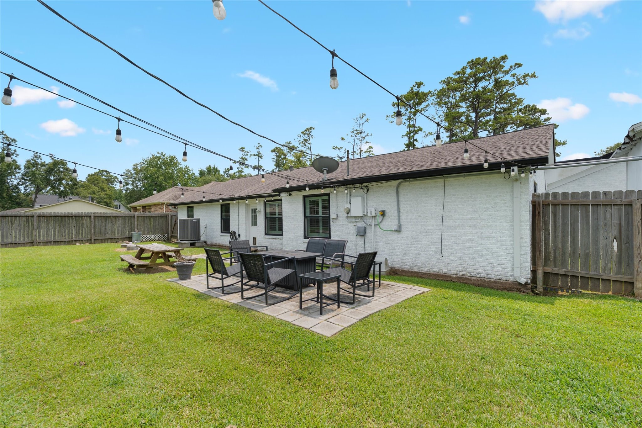 110 Dozent Lane Baytown, TX 77521 - Photo 30 of 36 a backyard of a house with table and chairs