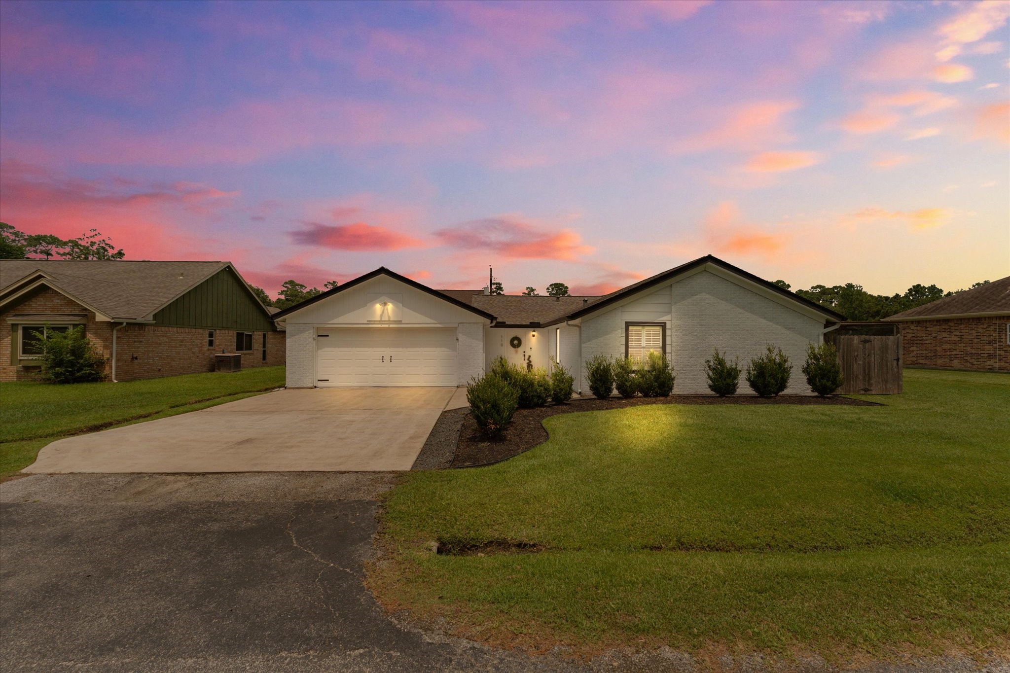 110 Dozent Lane Baytown, TX 77521 - Photo 34 of 36 a front view of a house with a yard and garage