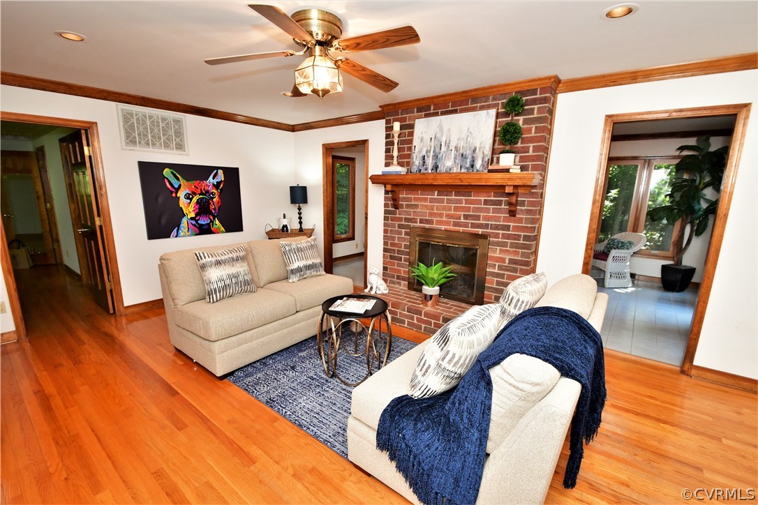 11101 Erin Road Chester, VA 23831 - Photo 5 of 46 a living room with furniture a fireplace and a flat screen tv