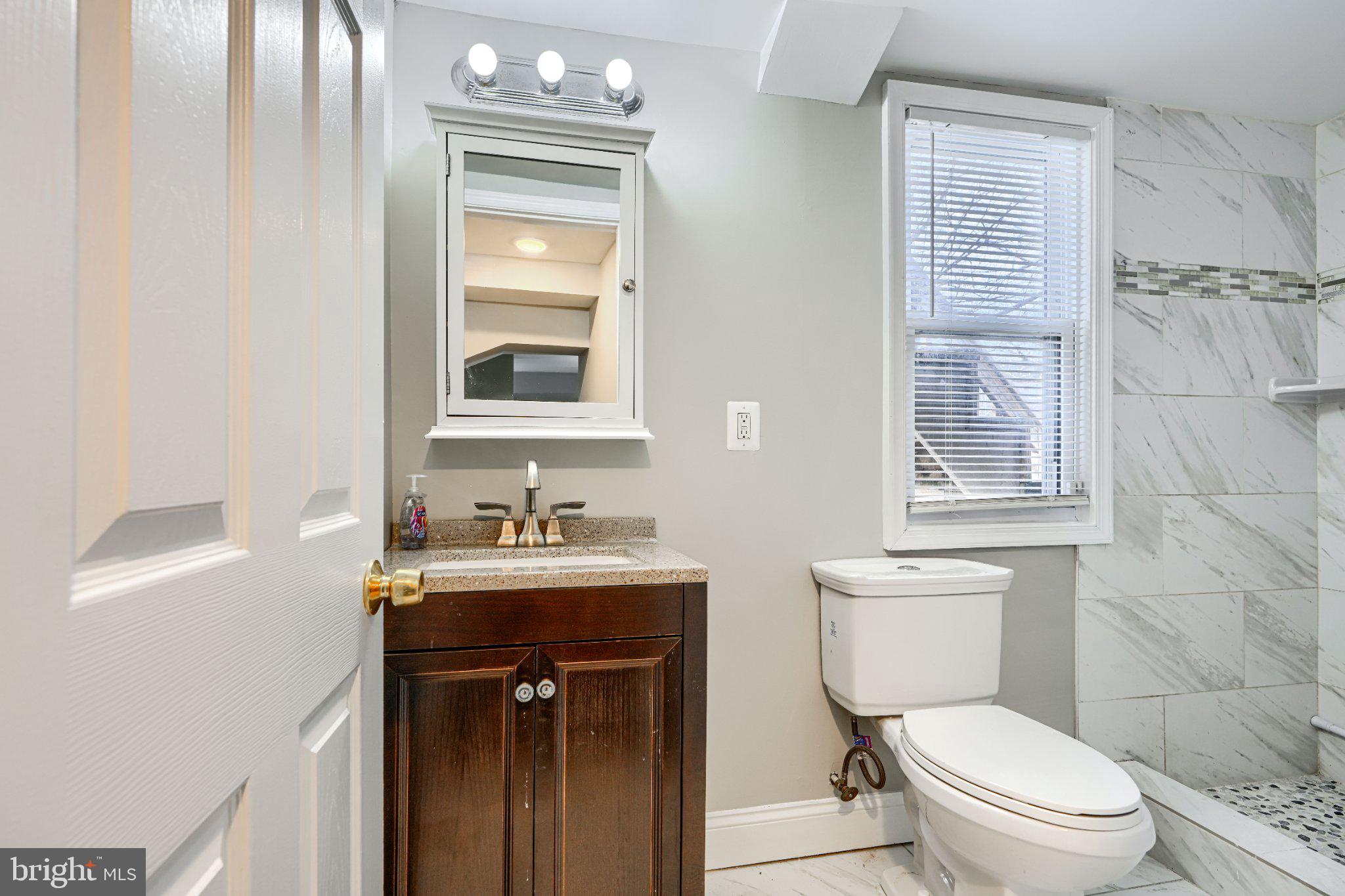 3414 Alto Road, Unit 1 Baltimore, MD 21216 - Photo 15 of 18 Modern bathroom with elegant finishes.