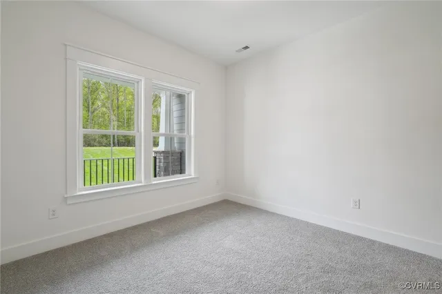 an empty room with closet area