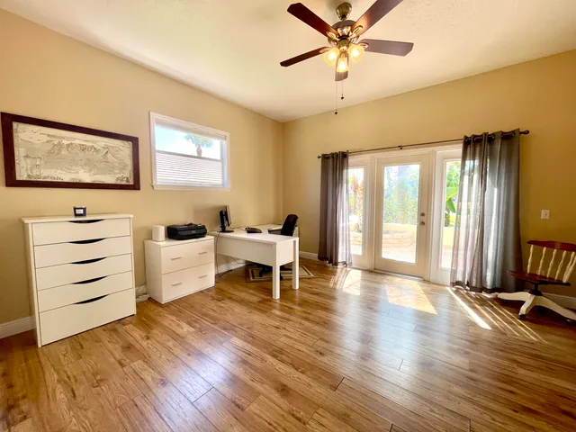 a view of a balcony with wooden floor and outdoor space