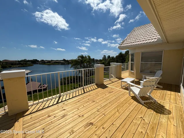 a bathroom with a granite countertop sink a mirror and shower