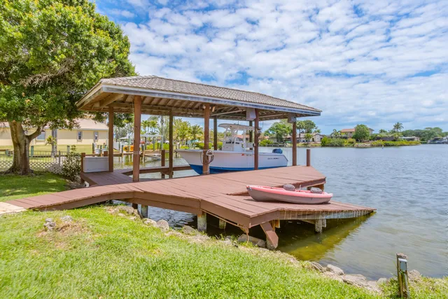 a room with pool table and windows