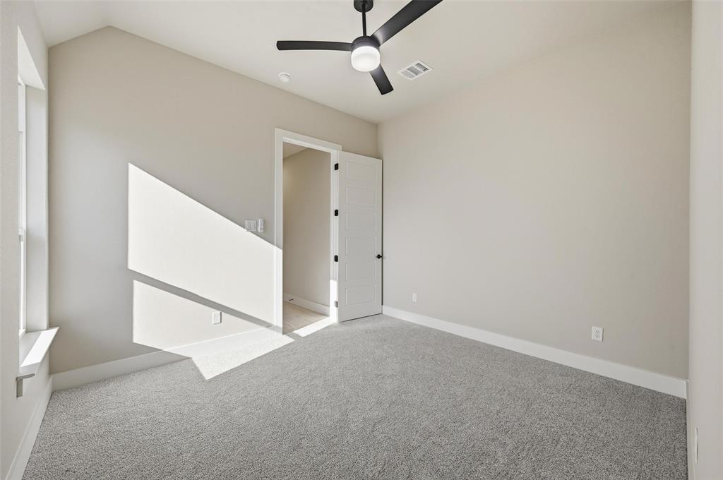 1053 Llano Way Poolville, TX 76487 - Photo 37 of 40 a view of an empty room with a ceiling fan