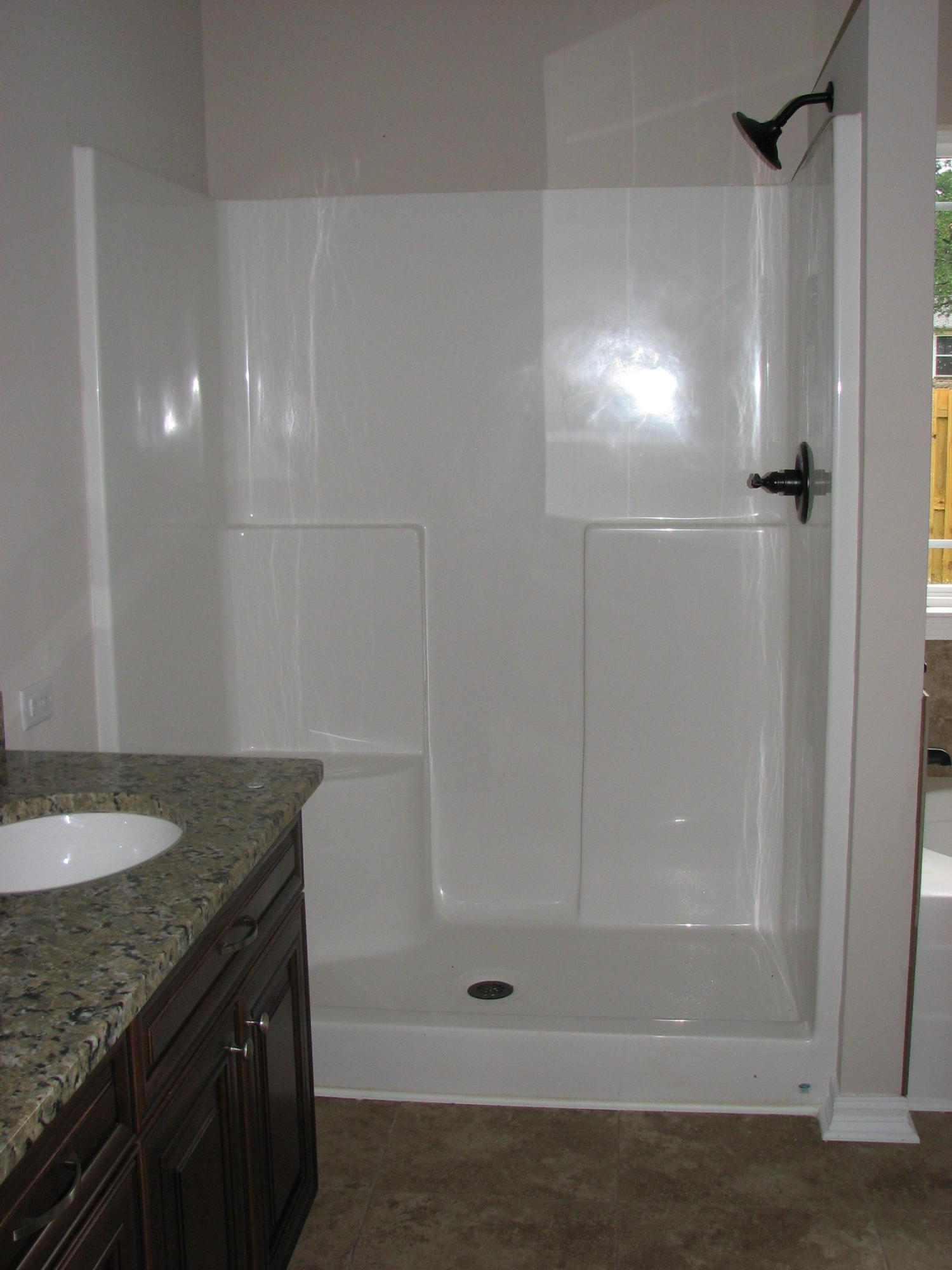 6020 Hidden Valley Road Crestview, FL 32539 - Photo 12 of 24 a bathroom with a granite countertop sink and a mirror