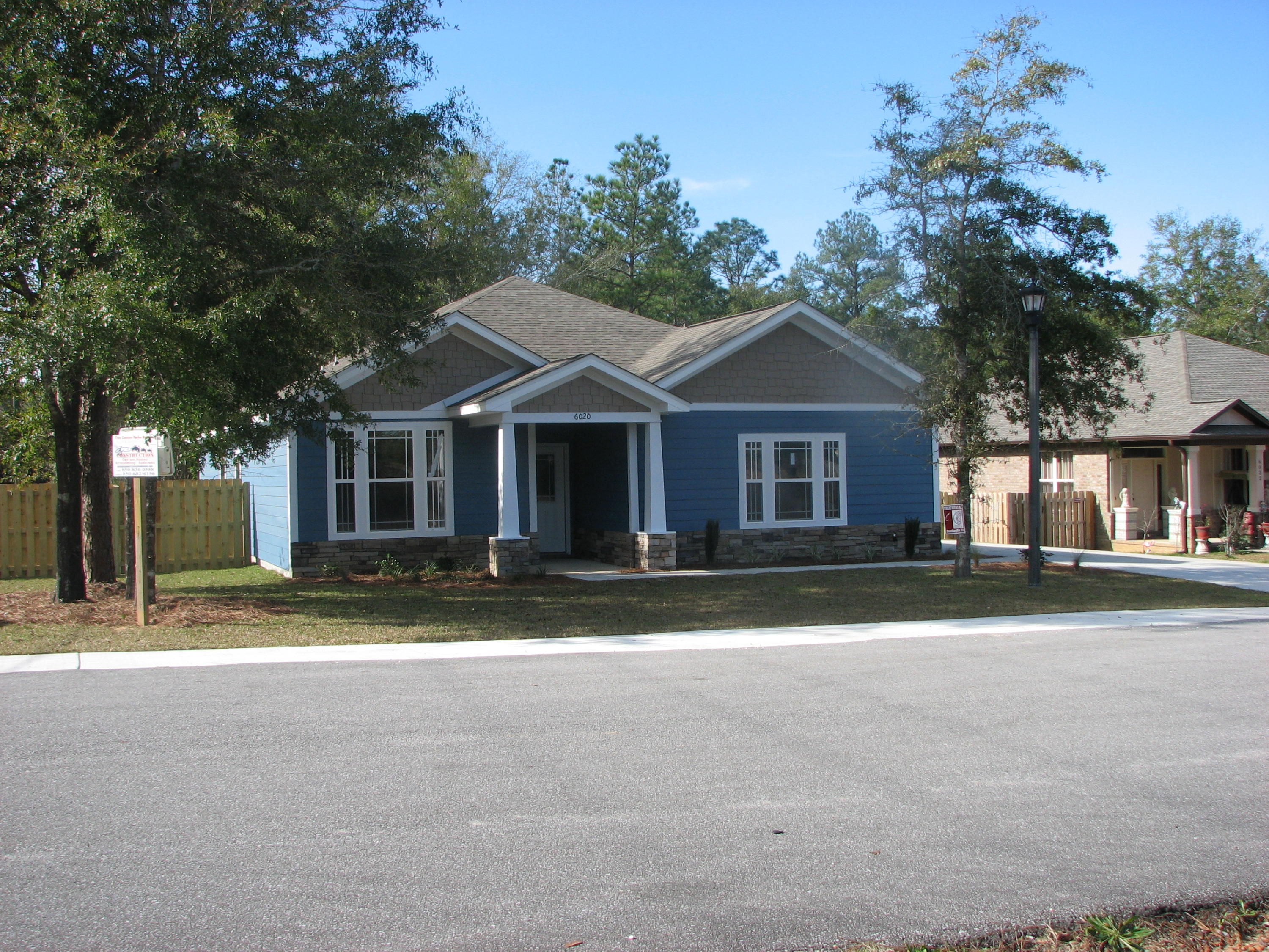 6020 Hidden Valley Road Crestview, FL 32539 - Photo 3 of 24 a front view of a house with a yard