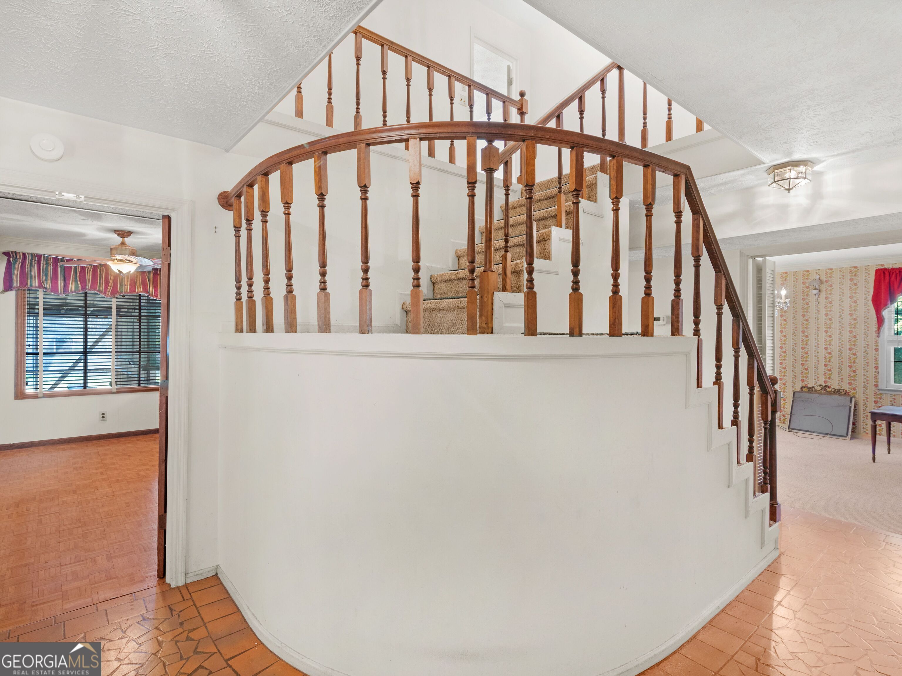209 Founders Drive Barnesville, GA 30204 - Photo 21 of 80 a view of staircase with lots of frames on wall and windows