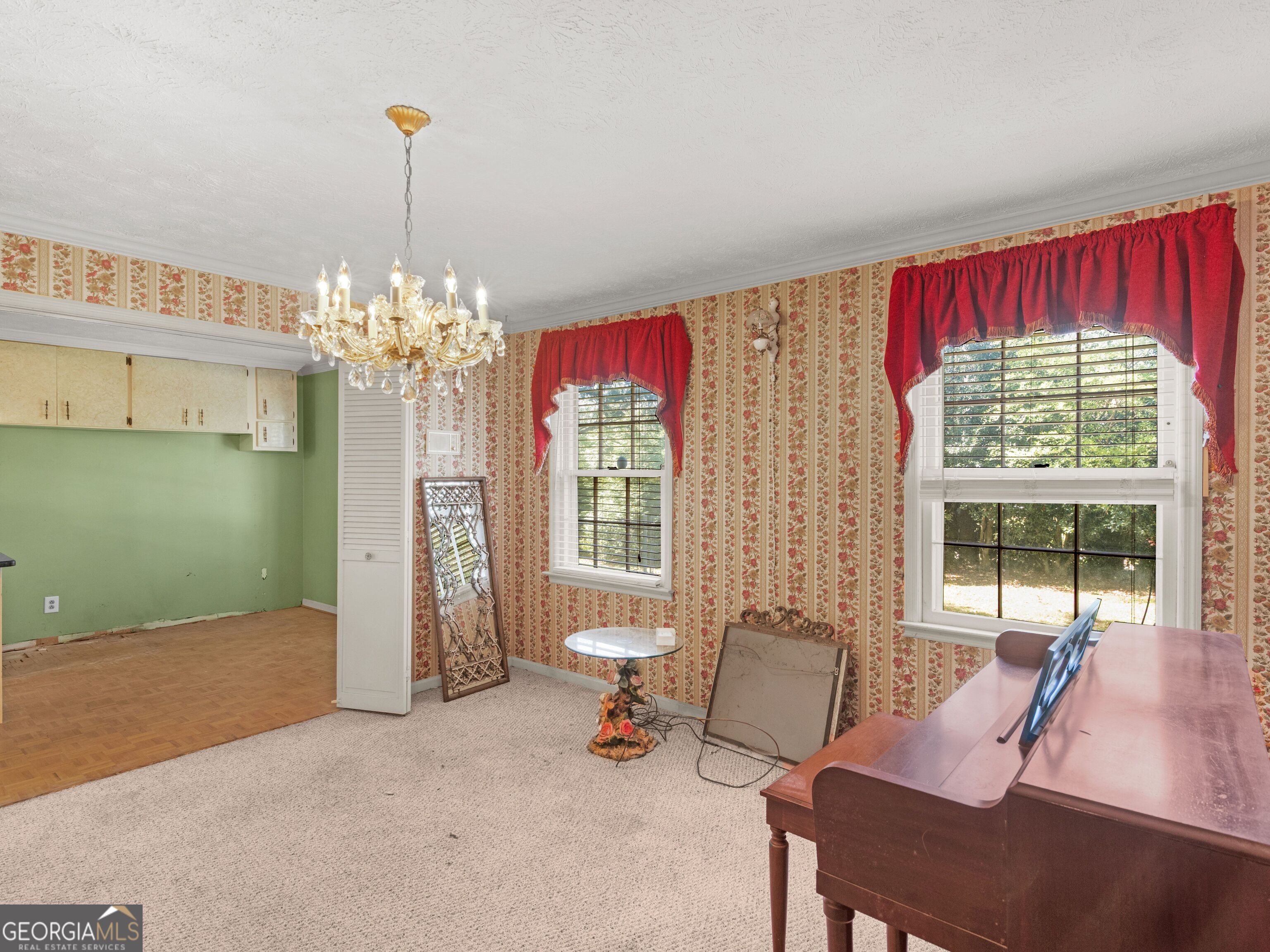 209 Founders Drive Barnesville, GA 30204 - Photo 24 of 80 a living room with furniture and a chandelier