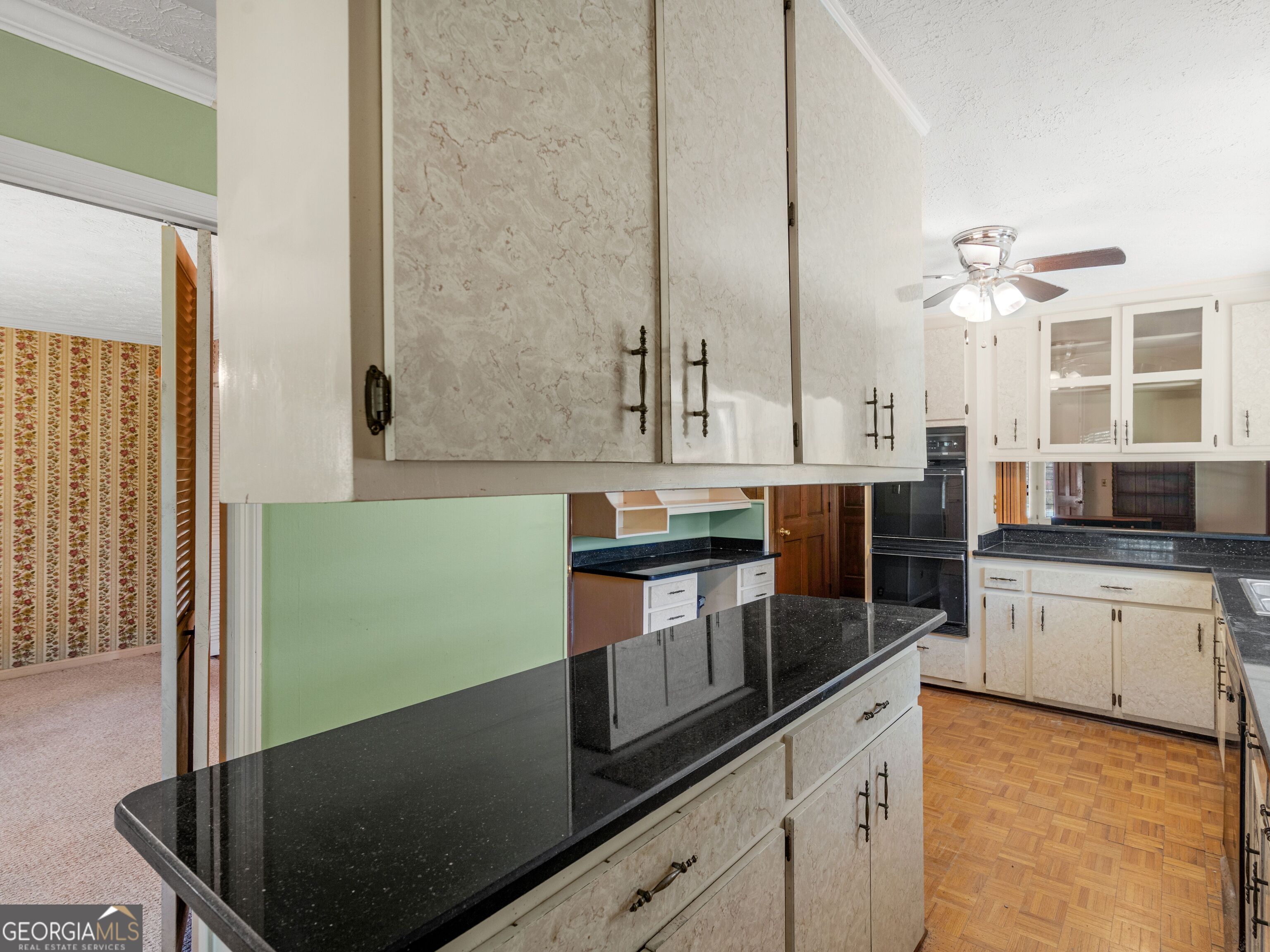 209 Founders Drive Barnesville, GA 30204 - Photo 30 of 80 a kitchen with stainless steel appliances granite countertop a sink a stove and a microwave