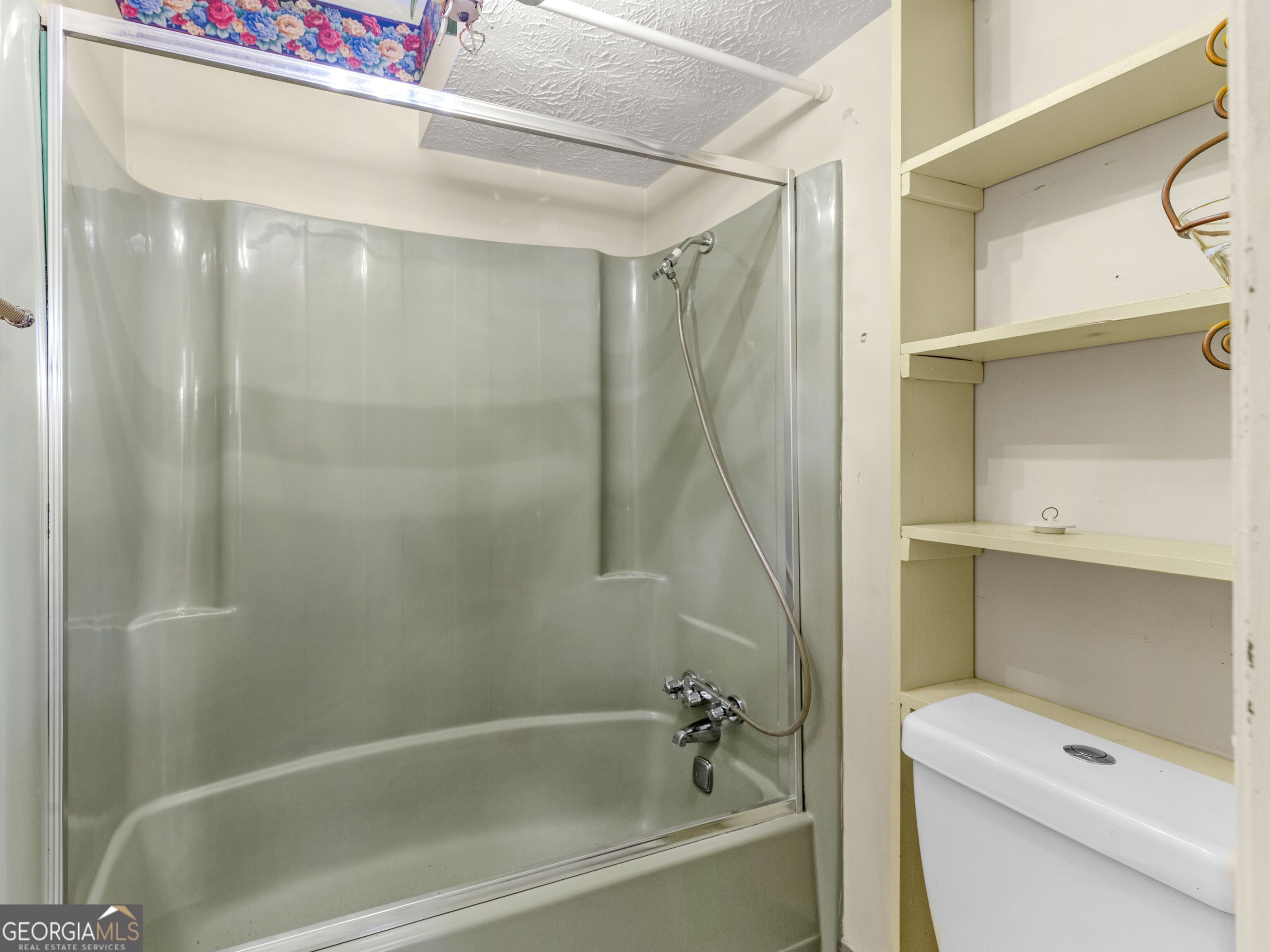 209 Founders Drive Barnesville, GA 30204 - Photo 59 of 80 a bathroom with a bathtub a toilet and a shower