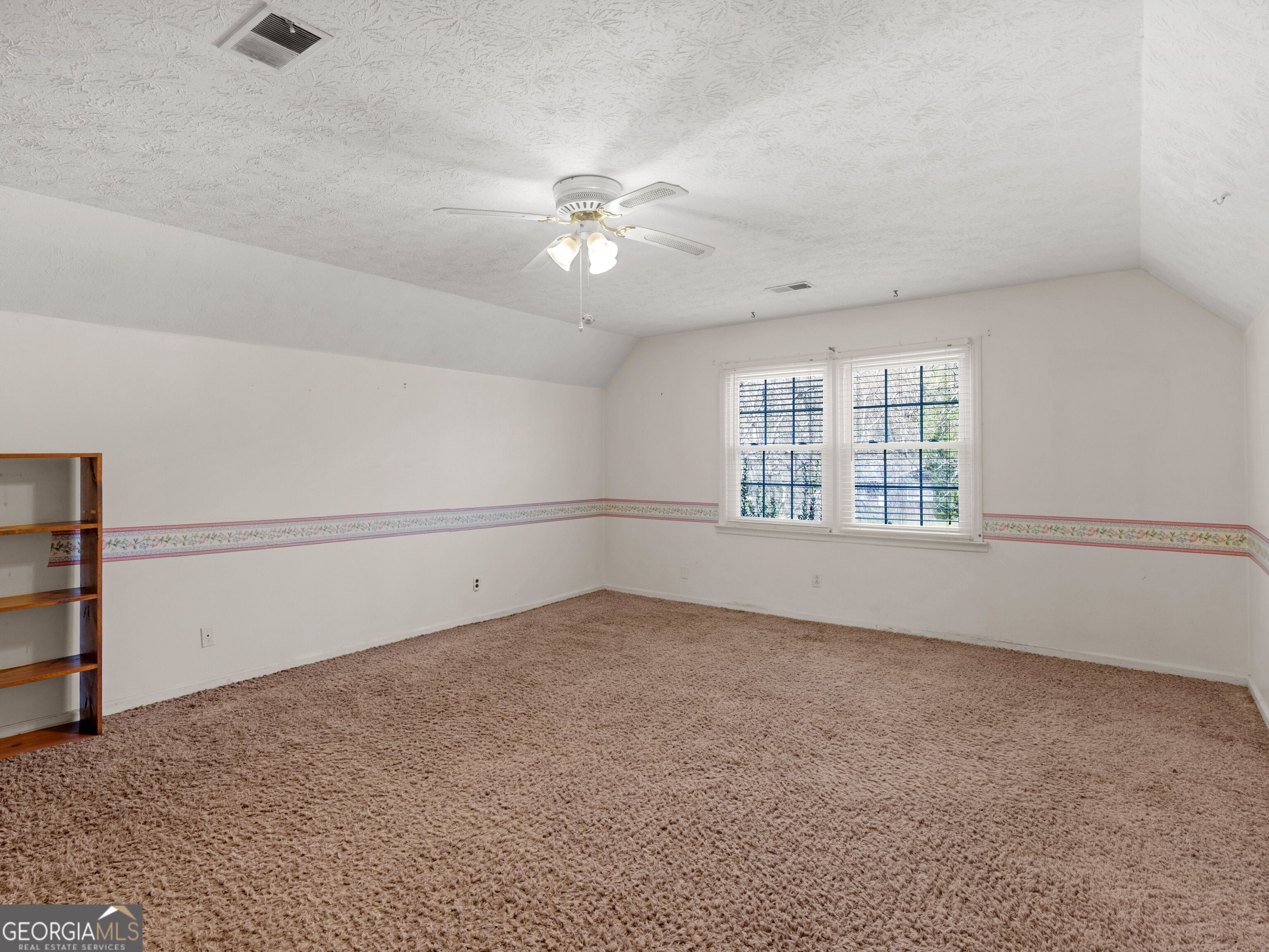 209 Founders Drive Barnesville, GA 30204 - Photo 63 of 80 an empty room with windows and ceiling fan view