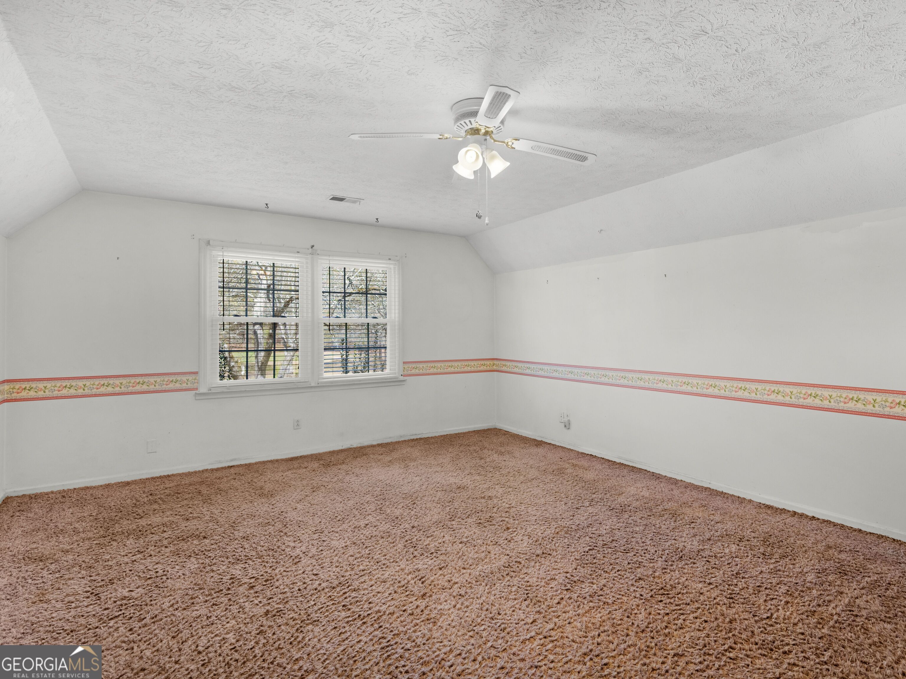 209 Founders Drive Barnesville, GA 30204 - Photo 66 of 80 a view of an empty room with a window