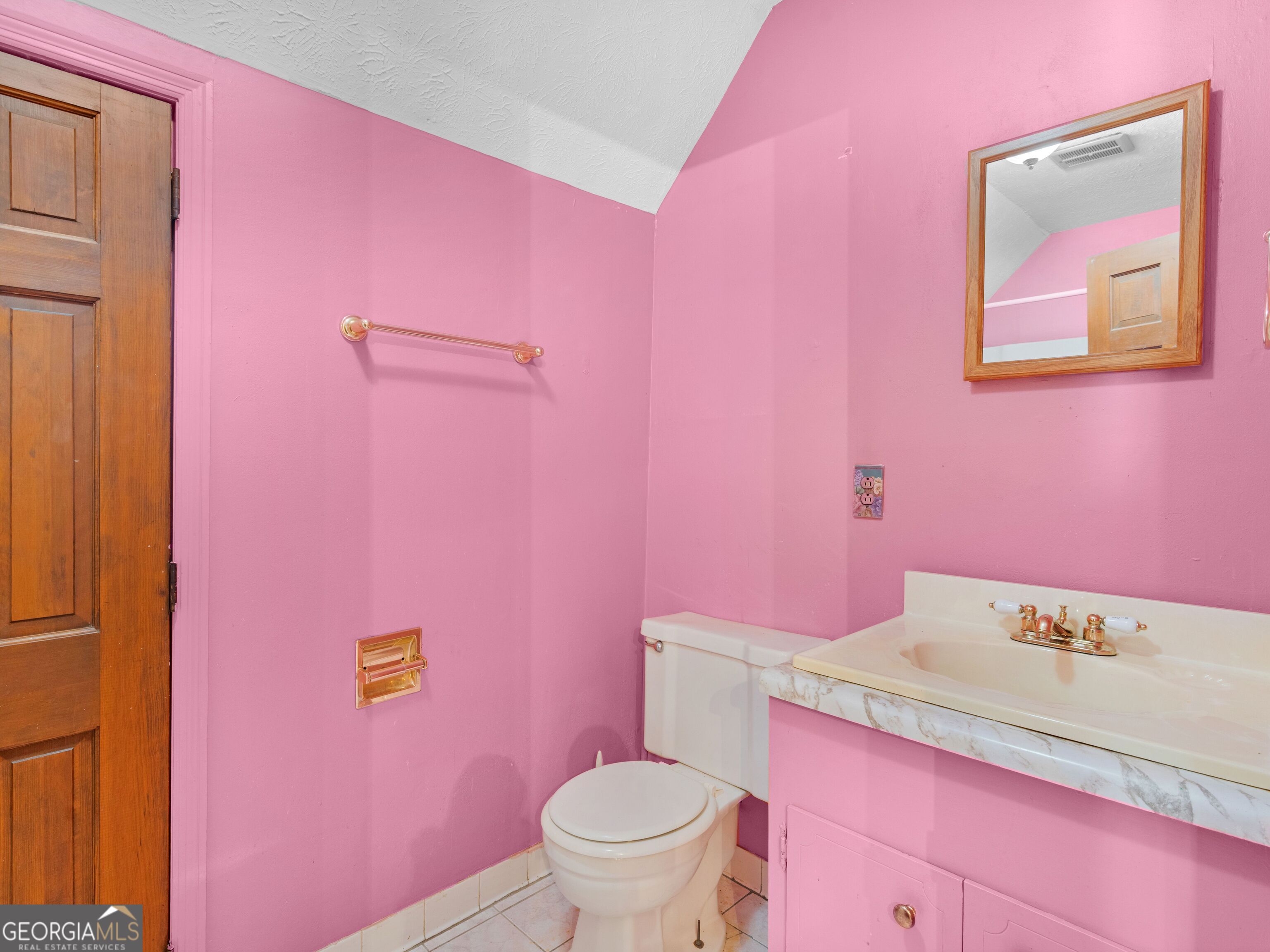 209 Founders Drive Barnesville, GA 30204 - Photo 67 of 80 a bathroom with a granite countertop toilet sink and mirror