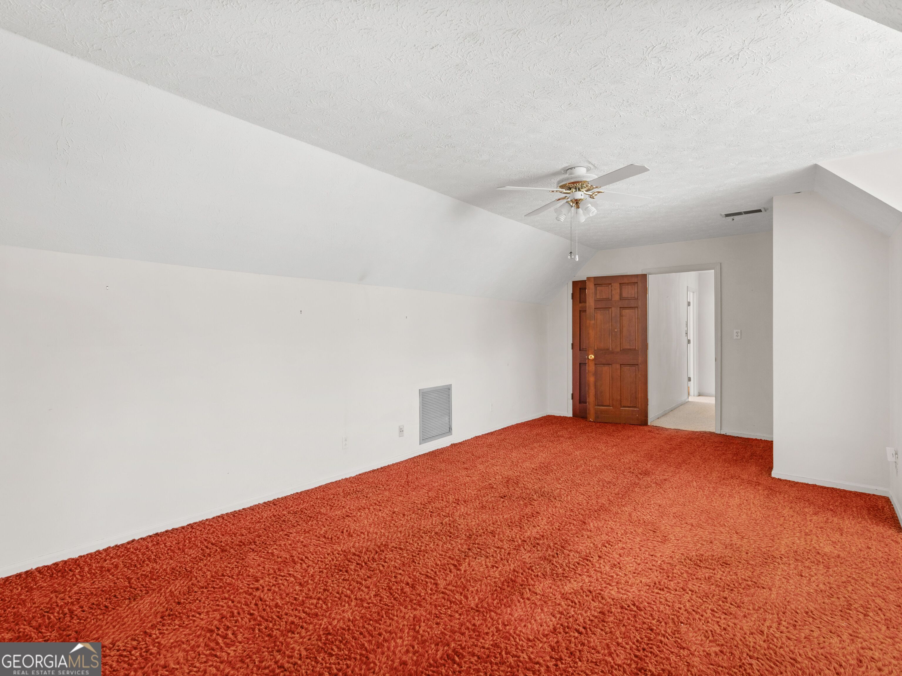 209 Founders Drive Barnesville, GA 30204 - Photo 76 of 80 a view of an empty room with a ceiling fan