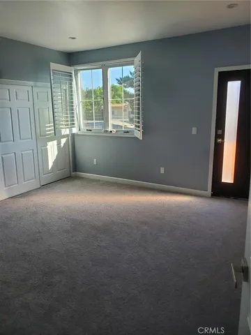 a view of an empty room and window