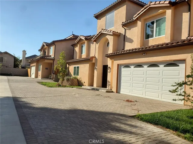 front view of a house with a street