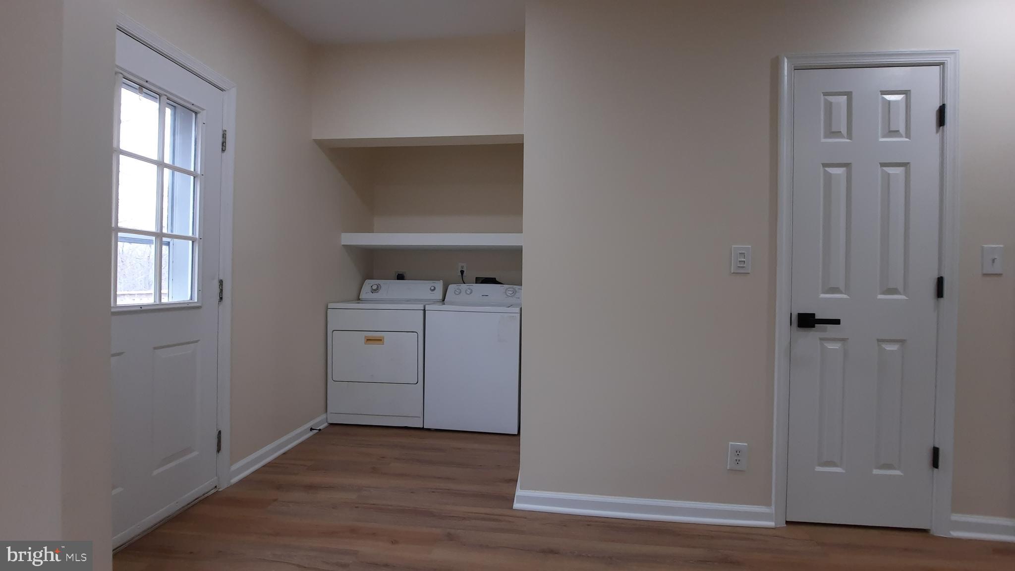 21051 Seigen Lane Richardsville, VA 22736 - Photo 14 of 42 a view of cabinets a sink and a window in a room