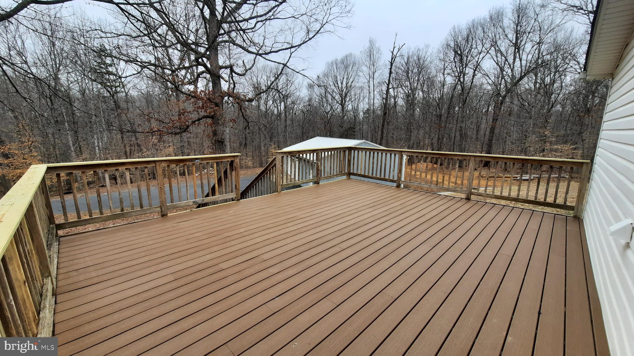 21051 Seigen Lane Richardsville, VA 22736 - Photo 23 of 42 a view of balcony with wooden floor and fence