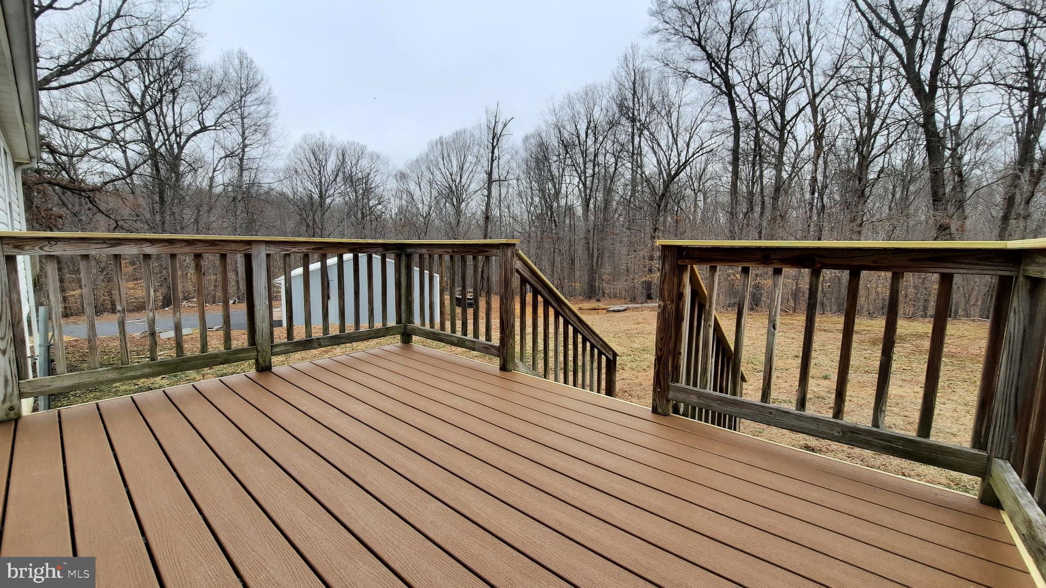 21051 Seigen Lane Richardsville, VA 22736 - Photo 29 of 42 a balcony with wooden floor and fence