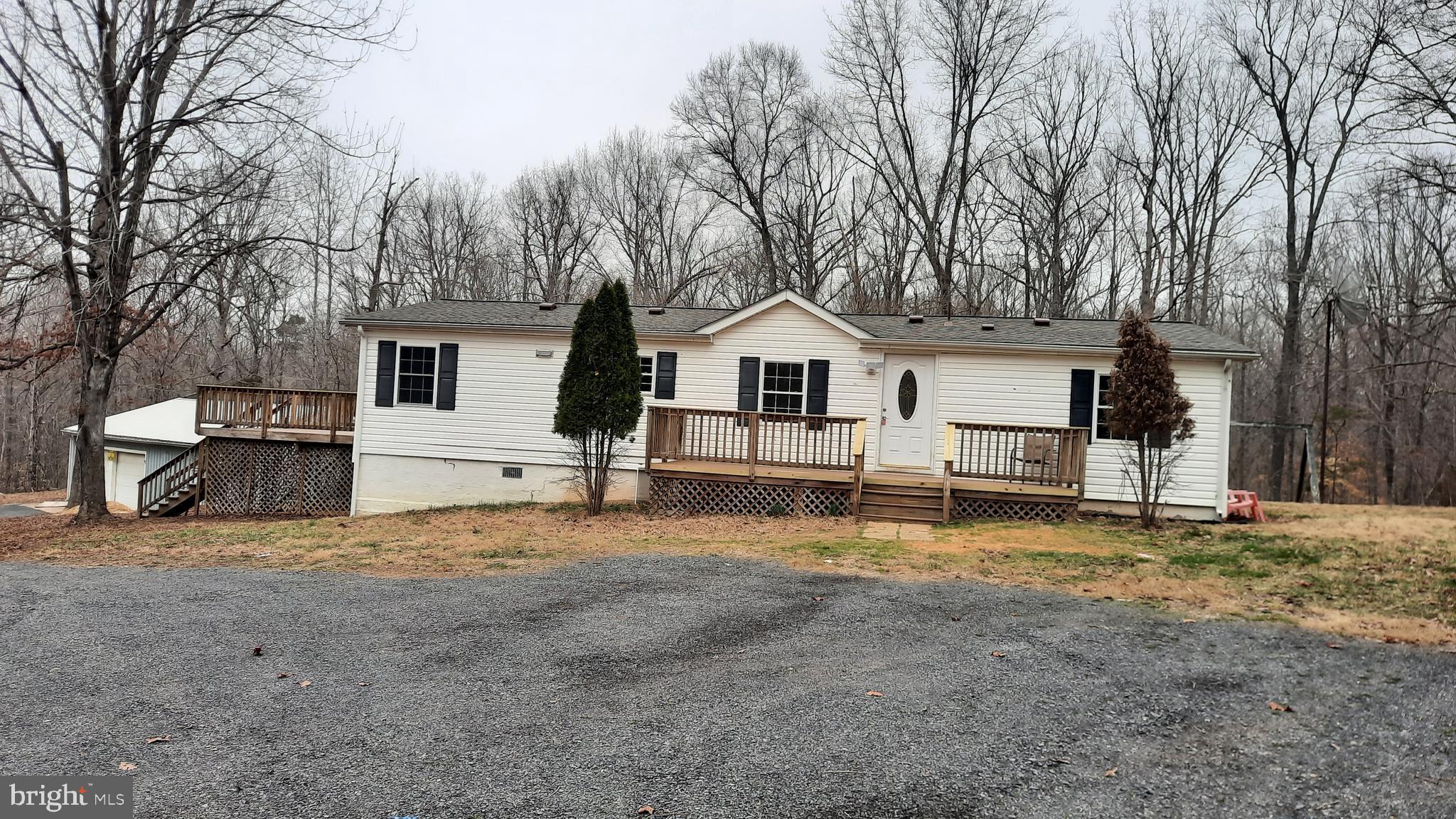 21051 Seigen Lane Richardsville, VA 22736 - Photo 3 of 42 a view of a house with a large tree and a yard