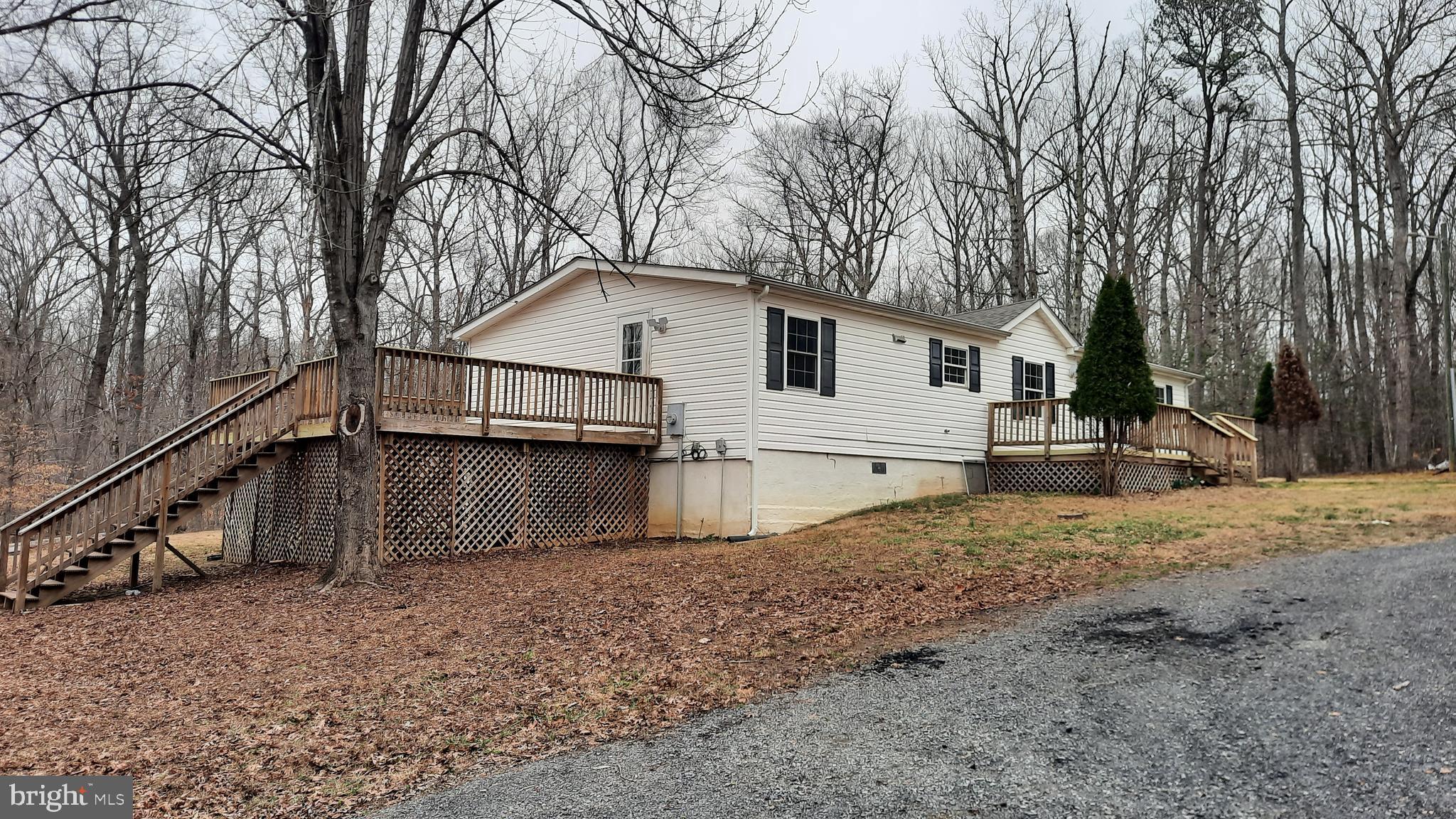 21051 Seigen Lane Richardsville, VA 22736 - Photo 31 of 42 a view of a house with a yard covered with snow