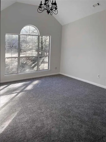 an empty room with a large window