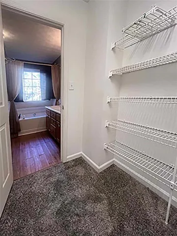 a view of a livingroom with furniture and wooden floor