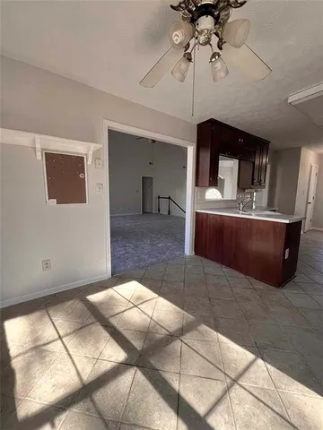 a lobby with furniture and chandelier