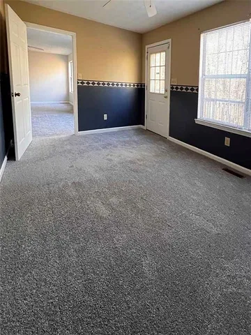 a view of an empty room and window