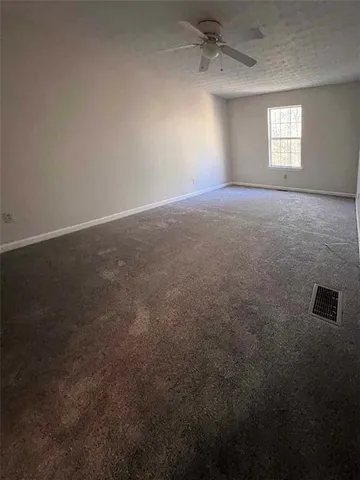 an empty room that has a window in it