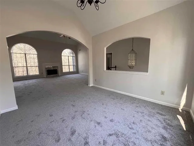 a view of a windows and fireplace in a room