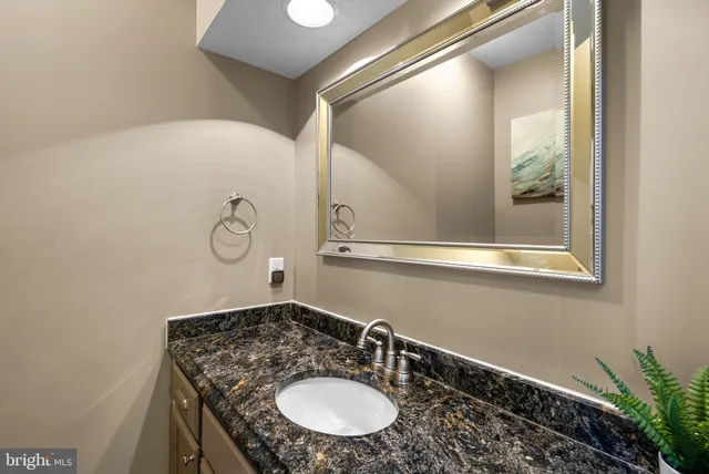 a bathroom with a sink double vanity and a mirror