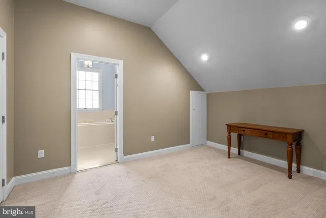 a view of a house with a wooden fence