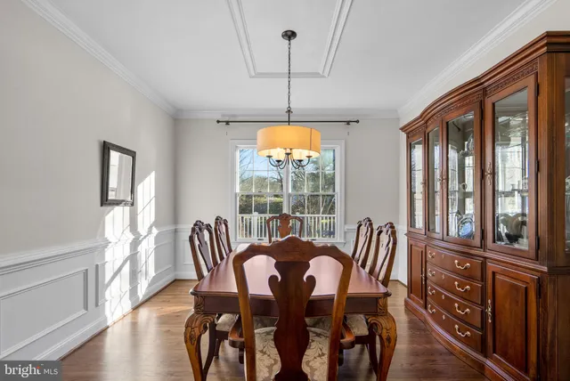 a kitchen with stainless steel appliances granite countertop a stove a refrigerator and a microwave