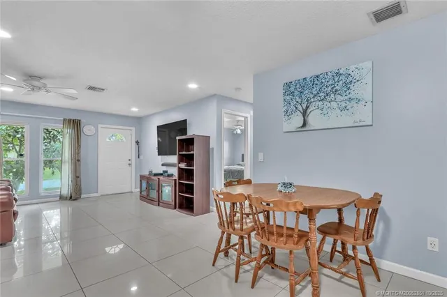 a view of a dining room with furniture and window