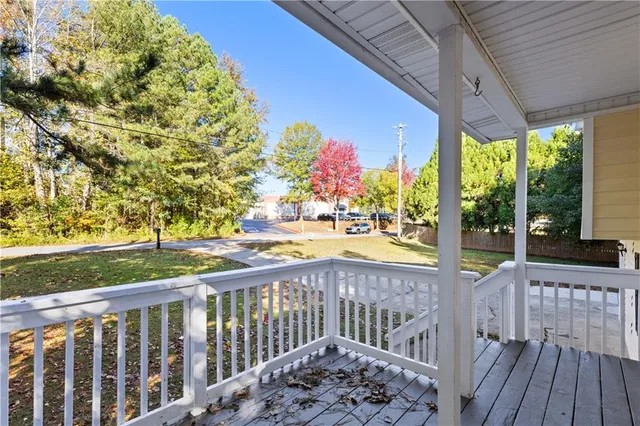 a view of a street with a large trees
