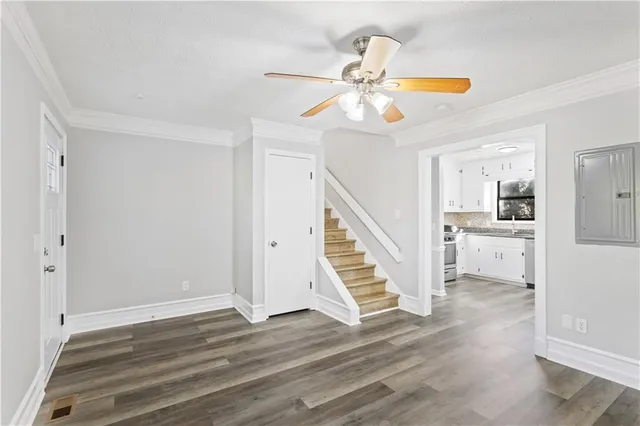 a view of an entryway and wooden floor