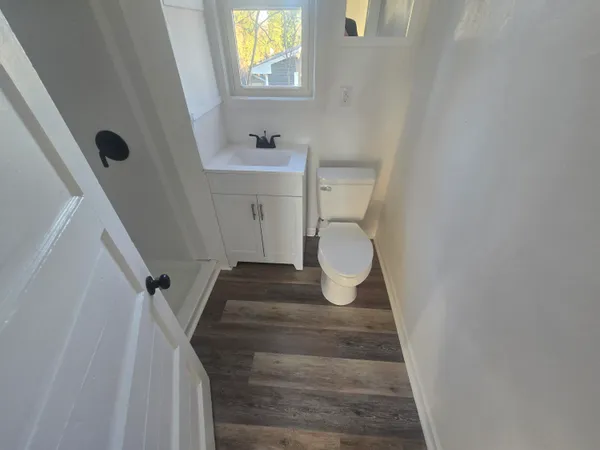 a view of a bathroom with a sink and a window