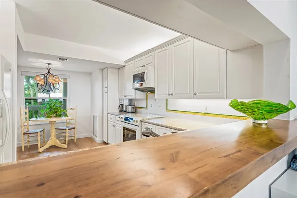 a living room with furniture a window and a table