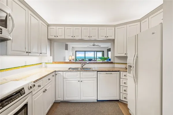a bedroom with furniture and a large window
