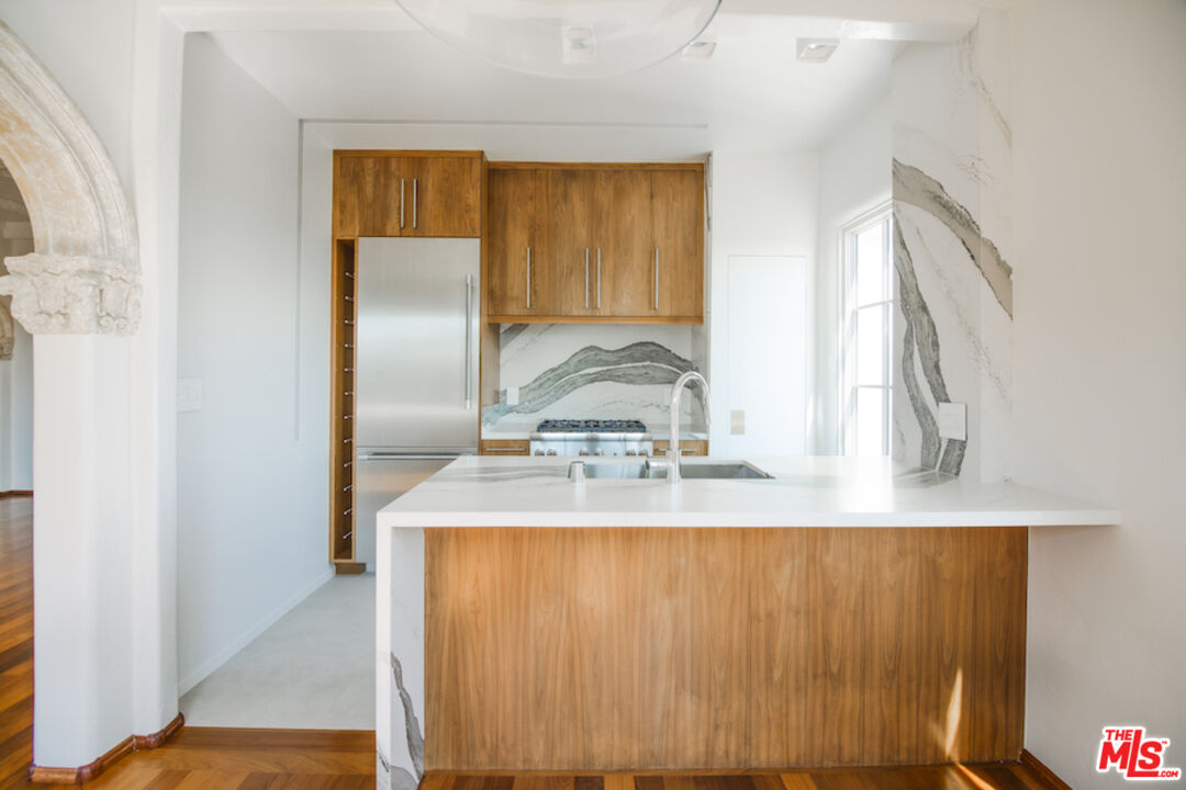 1302 North Sweetzer Avenue, Unit 402 West Hollywood, CA 90069 - Photo 4 of 23 a view of kitchen with wooden floor