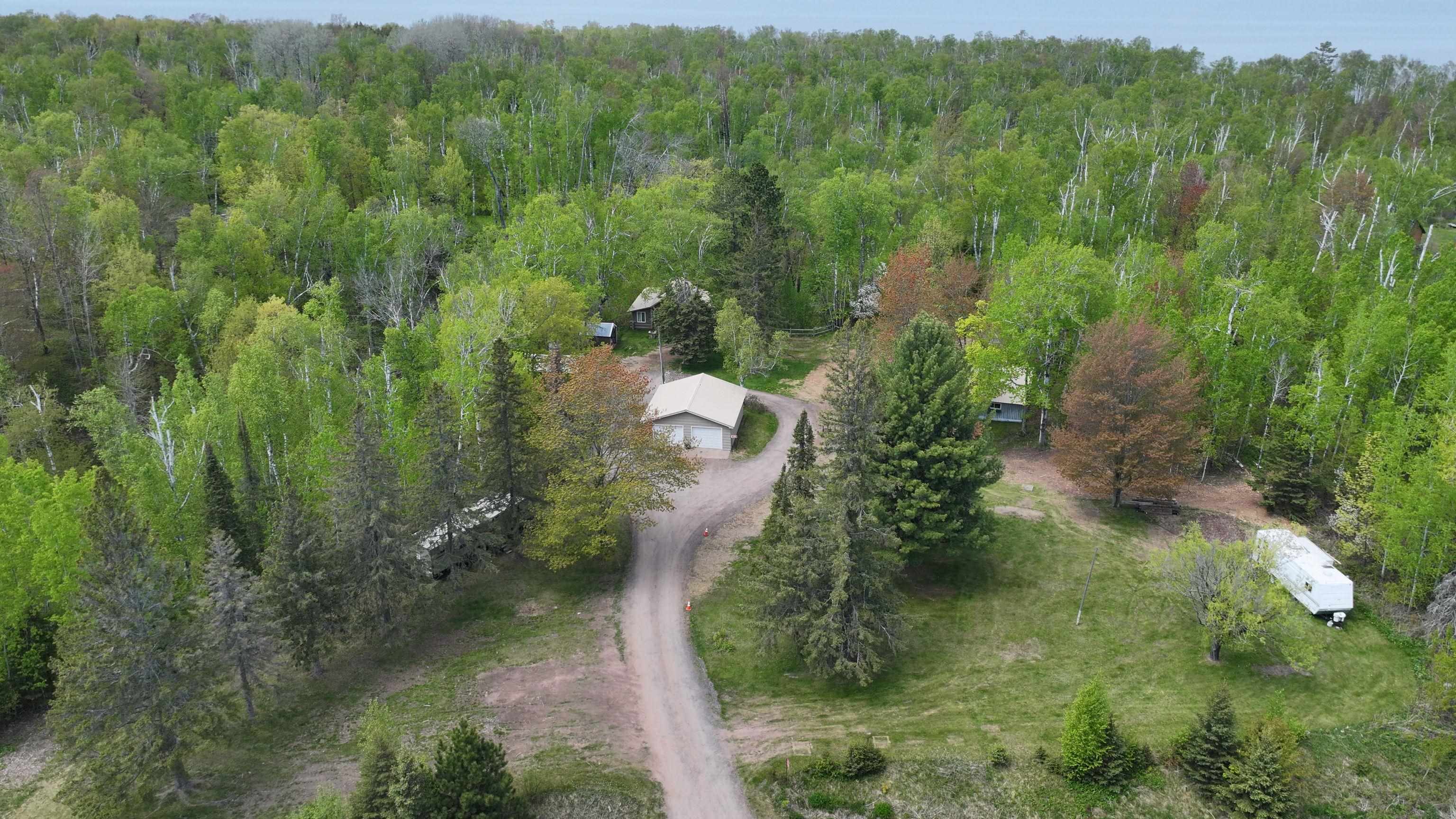 13770 State Highway 13 Herbster, WI 54844 - Photo 12 of 13 Aerial overview of property's location with a heavily wooded area