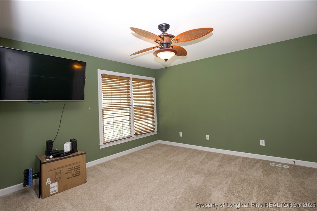 175 Knoll Road Southern Pines, NC 28387 - Photo 21 of 50 a view of an empty room with a window