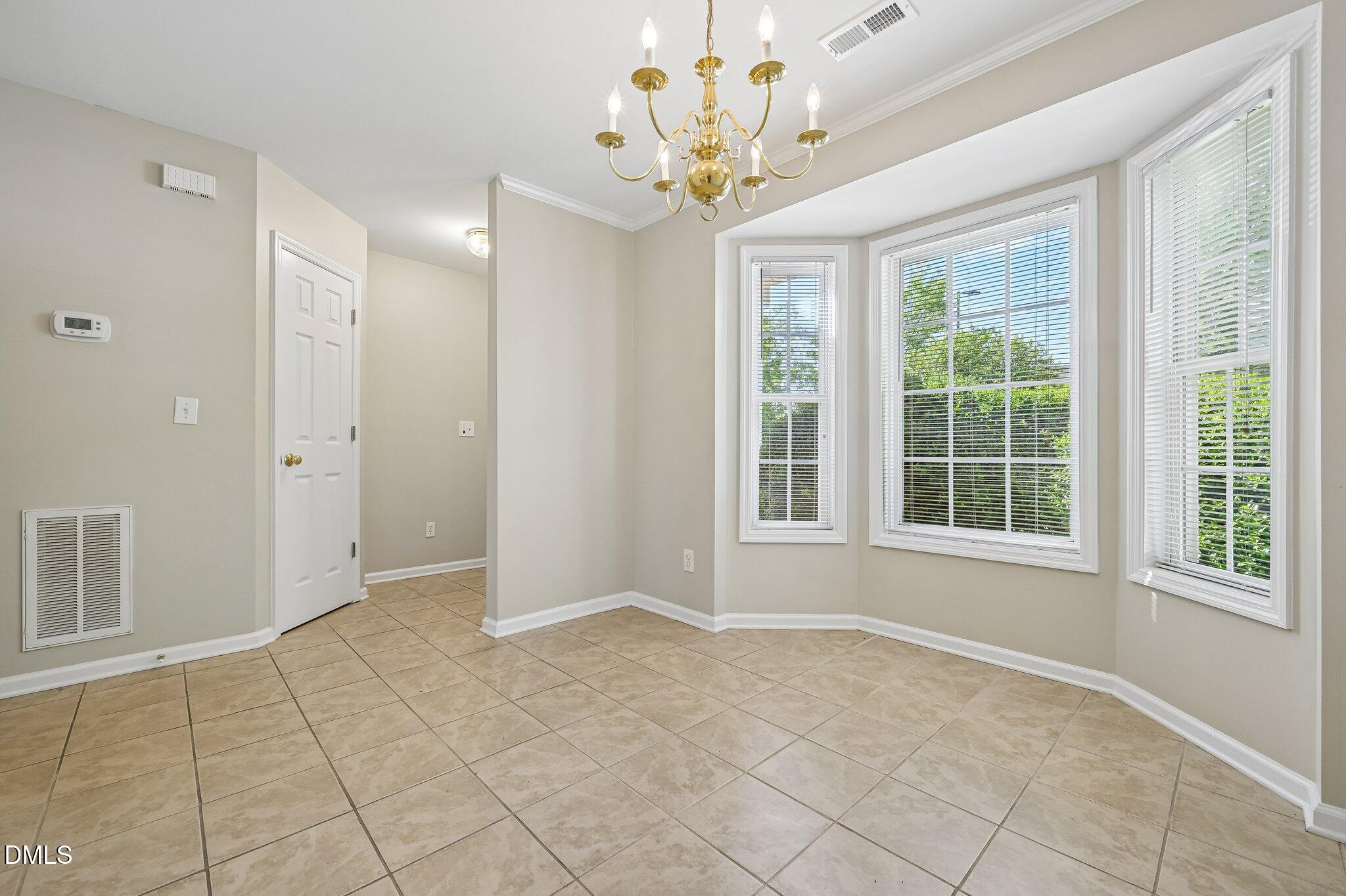 278 South Raleigh Street Angier, NC 27501 - Photo 8 of 35 a view of an empty room with a window