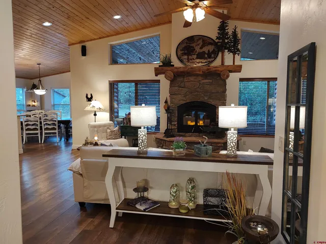 a kitchen with a table chairs and a fireplace