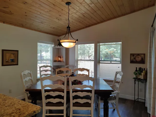 a view of a livingroom with furniture and a window