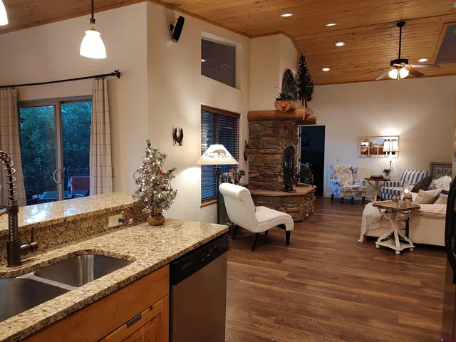 a backyard of a house with table and chairs