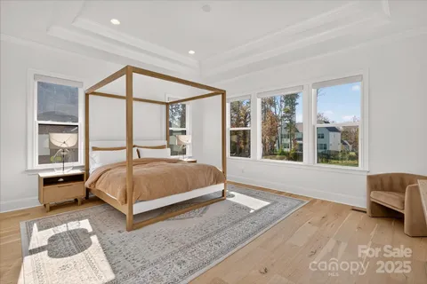 a bedroom with a large bed and a large window