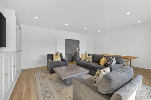 a living room with furniture and a rug